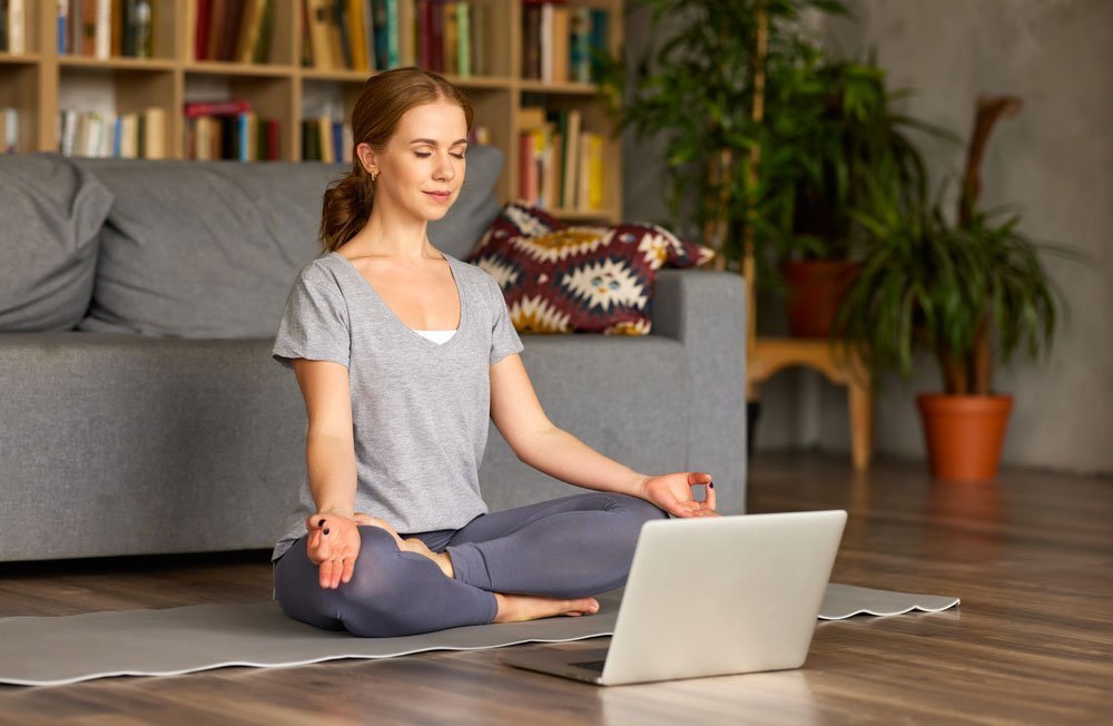 Woman meditating at home